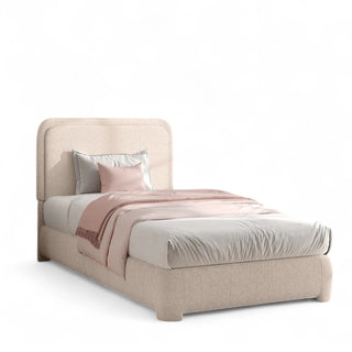 Creamy boucle bed frame with rounded curved headboard in a modern bedroom setting