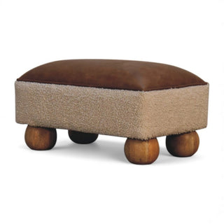 Rectangular ottoman with brown top and textured beige base on wooden wheels.