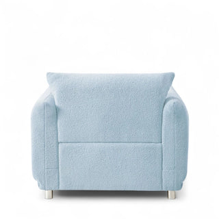 Back view of light blue boucle armchair showing the full silhouette and proportions