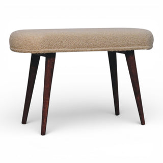 Beige ottoman with dark wooden legs on a white background