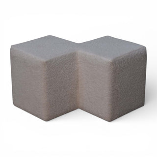 Gray foam block with a unique design on a white background