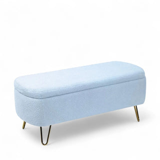 Blue boucle storage bench with gold legs and upholstered seat