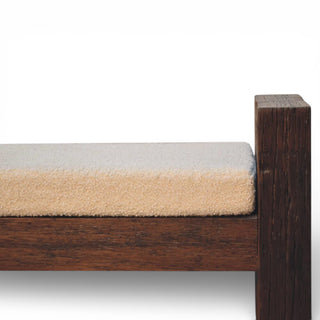 Wooden bench with a cushion on a white background
