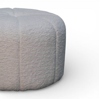 Round gray pouf on a white background