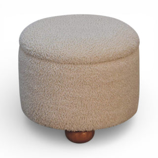 Round beige ottoman with a wooden foot on a white background