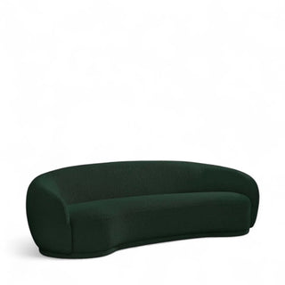 Dark green curved boucle sofa with modern silhouette and plush foam cushions