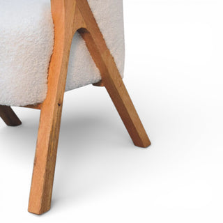 Close-up of a chair with wooden legs on a white background