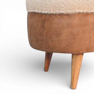 Brown leather ottoman with wooden legs on a white background