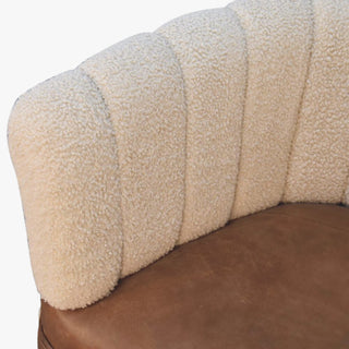 Close-up of a textured beige headrest on a vehicle seat.