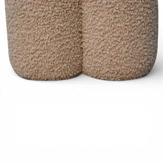 Two textured brown containers on a white background