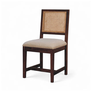 Wooden chair with woven backrest and beige cushion on a white background