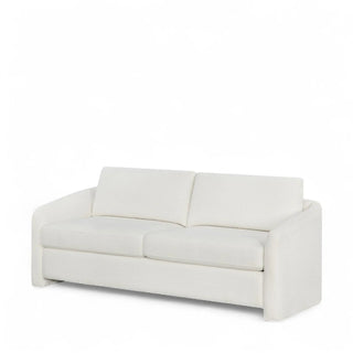 Right angle perspective of the cream boucle couch showcasing side profile and cushion depth.
