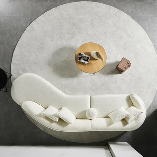 White boucle sectional styled with decorative accessories showing versatile styling possibilities