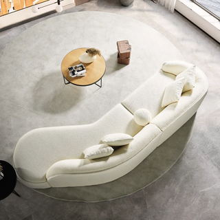 Overhead view of curved sectional sofa showing expansive 133-inch width and organic curved silhouette