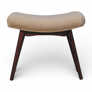 Stool with beige cushioned top and dark wooden legs on a white background