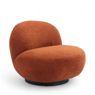 Quarter angle view of terracotta textured lounge chair showing the graceful curve from backrest to seat