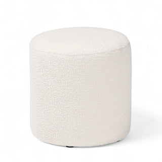 Ivory boucle cylindrical ottoman against white background