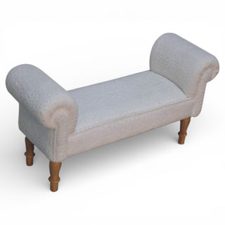 Gray upholstered bench with wooden legs on a white background