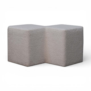 Gray textured L-shaped ottoman on a white background