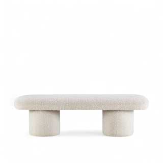 Harmony Pillar Bench showing oval top with dual cylindrical supports in ivory boucle fabric