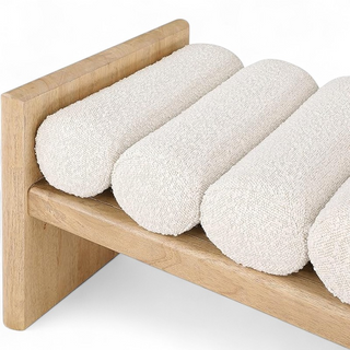 Kyoto Bolster Bench showing natural oak frame with cream boucle cylindrical cushions