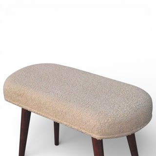 Close-up of a wooden bench with a textured surface on a white background