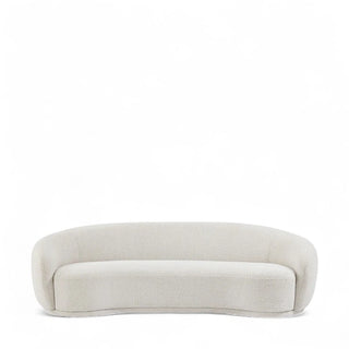 Contemporary curved boucle sofa with round arms in cream white, featuring tight back cushions and plush foam seating