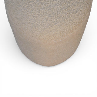 Close-up of a textured ceramic vase on a white background