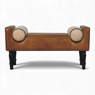 Front view of a modern bouclé accent bench featuring tan upholstery, cream bouclé bolster pillows, and dark wooden legs.