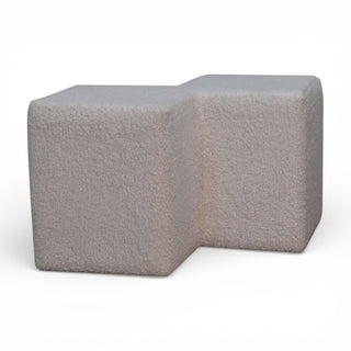 Gray L-shaped ottoman on a white background