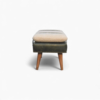 Stool with cushioned seat and wooden legs on a white background