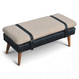 Bench with blue leather seat and beige cushion on a white background