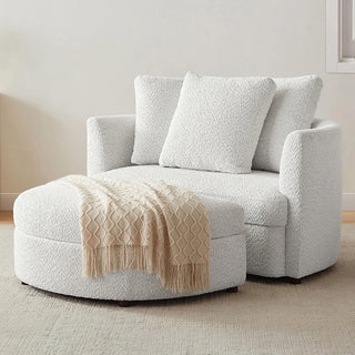 Cream oversized boucle chair with matching ottoman in living space