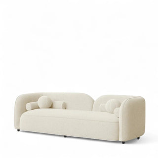 Close-up view of ivory boucle sofa showing textured fabric detail and tailored construction
