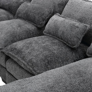 Close-up of gray boucle fabric texture on sectional sofa