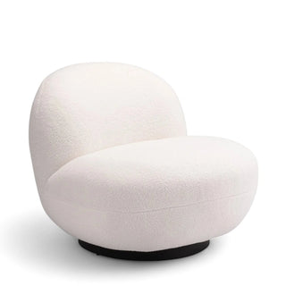 Side profile of white boucle accent chair showing curved silhouette and proportions