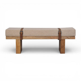 Wooden bench with woven seat and leather straps on a white background