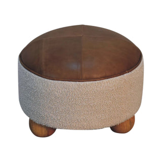 Round ottoman with brown leather top and textured beige base on a white background