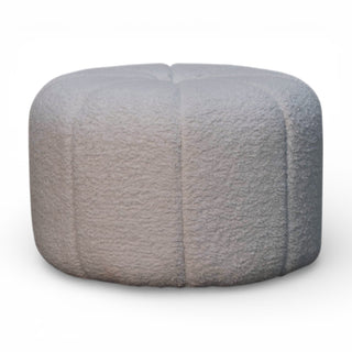 Round gray textured ottoman on a white background