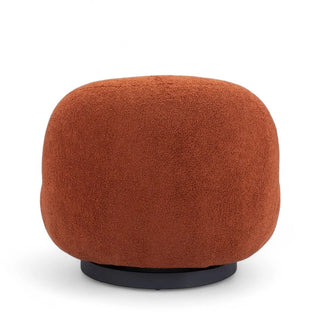 Back profile of terracotta boucle lounge chair highlighting its continuous curved form and proportions