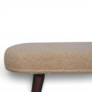 Close-up of a textured beige cushion on a white background