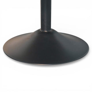 Close-up of a black metal pedestal base on a white background