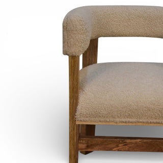 Chair with wooden frame and beige cushioned seat and backrest on a white background