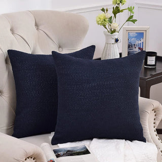 Boucle pillow covers arranged on sofa in contemporary living space