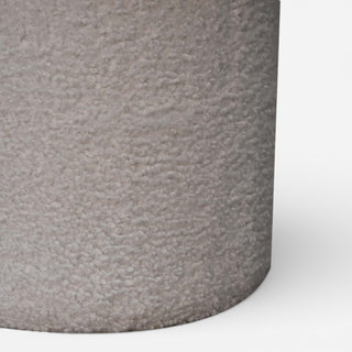 Close-up of a textured gray cylindrical object on a white background