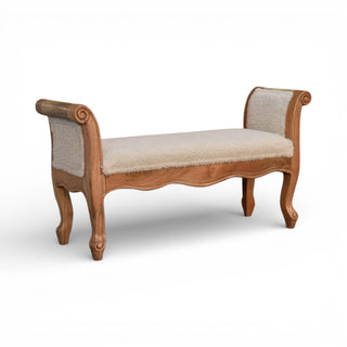 Wooden bench with upholstered seat and backrest on a white background