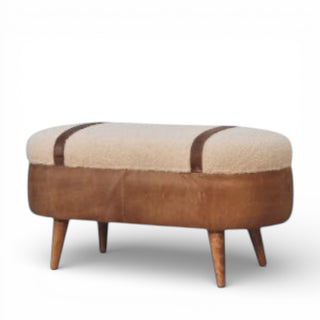 Round ottoman with brown leather and beige cushion on a white background