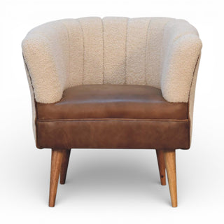 Beige upholstered chair with wooden legs on a white background
