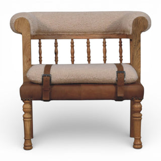 Chair with wooden frame, cushioned seat, and leather straps on a white background