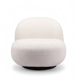 Front view of cream boucle accent chair with rounded organic shape and steel base